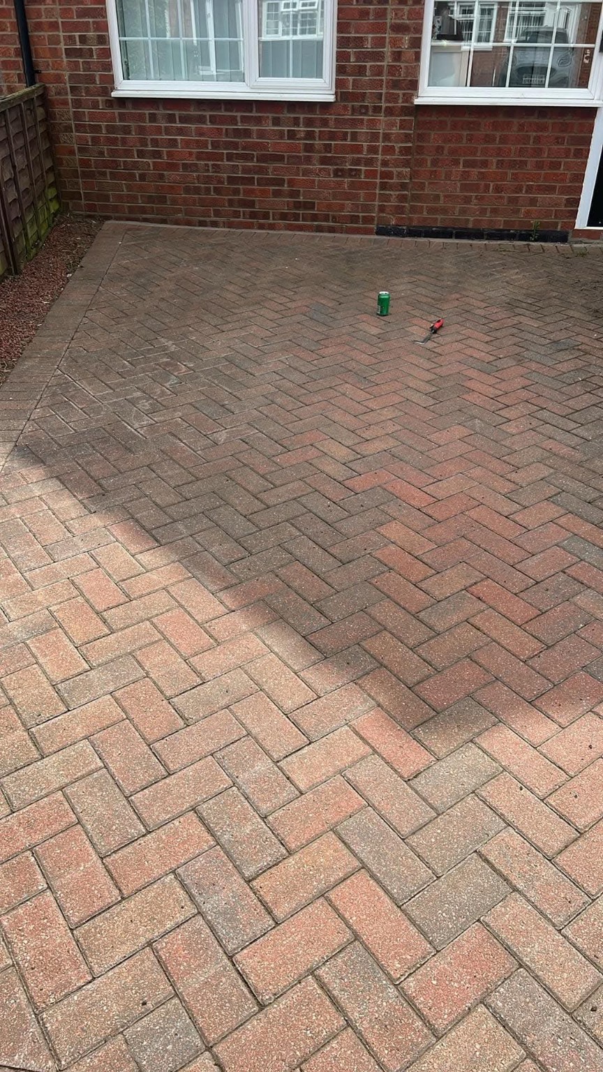 Herringbone block paving outside a house
